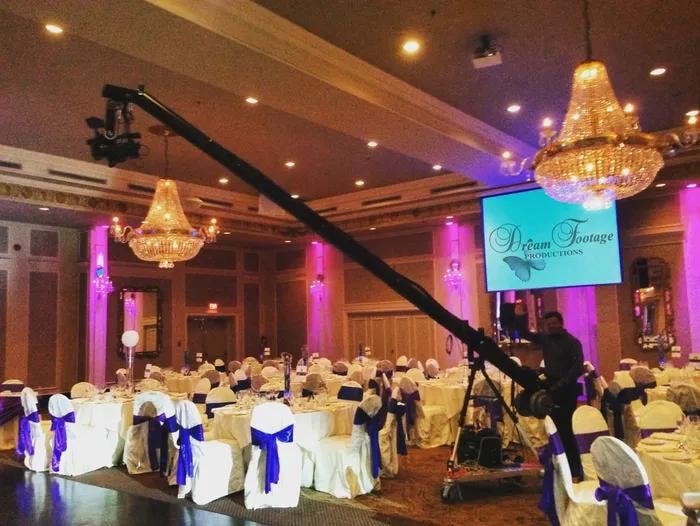 Professional videographer filming at a wedding ceremony